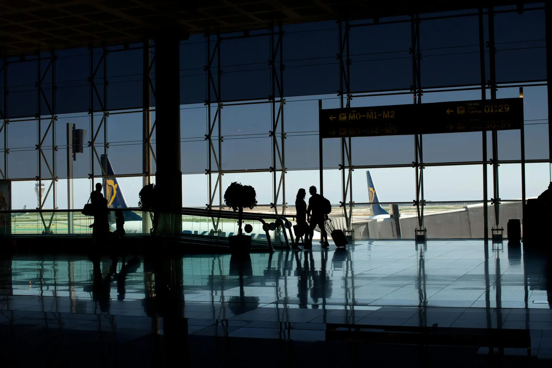 Ryanair aircraft on the tarmac. viewed from the airport departures lounge.